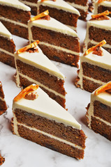Slice of chocolate carrot cake on buffet table  