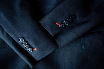 Top view of the Black suit with sleeves with buttons. Bird eye view of the Long sleeved black suit.