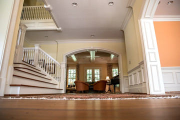 ow angle view of corridor hallway with hardwood floors and stair and waincot and copy space
