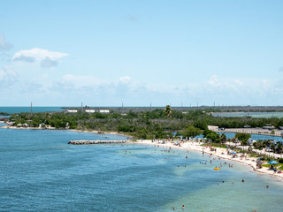 Fototapeta na wymiar Calusa Beach, Florida Keys, Florida, USA. Bahia Honda State Park. Peopke enjoying the beautiful beach in a hot summer day