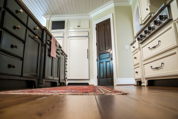 low view of kitchen with hardwood floors and custom 