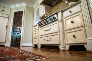 low view of kitchen with hardwood floors and custom cabinets
