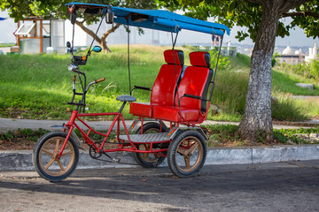 Fototapeta na wymiar Tricycle made into a taxi in Havana, Cuba