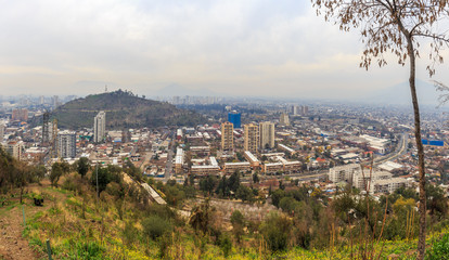 Fototapeta na wymiar Panoramic view of Santiago's pollution from San Cristobal Hill in Chile.