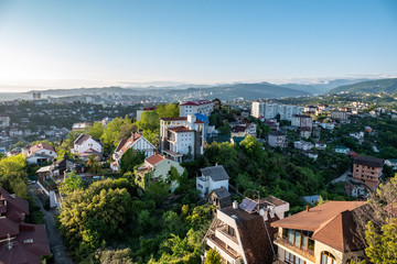 Green valley with the city Sochi in the sunshine.