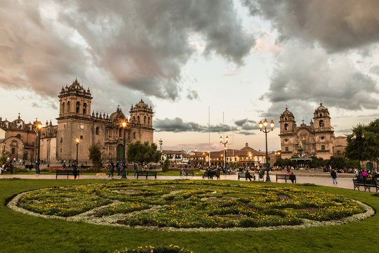 Sunset at main square of Cusco, Peru. With view of churches (Cathedral and Company).