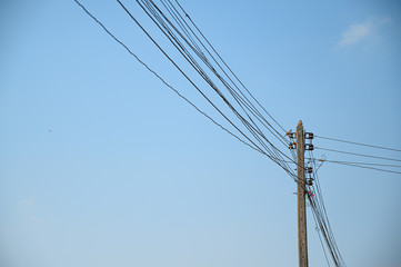 Electricity concept. Close up high voltage power lines station.