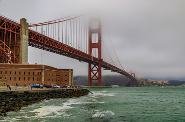 Golden Gate bridge with low fog rolling in San Francisco, California