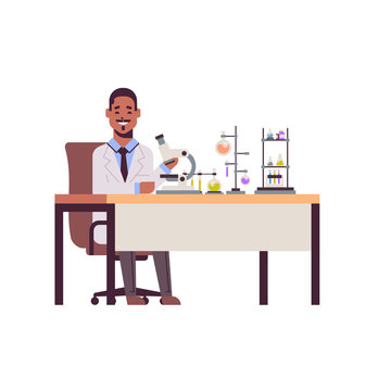 male scientist working with microscope african american man in uniform sitting at table making scientific experiments in chemistry laboratory with test tubes research science concept full length