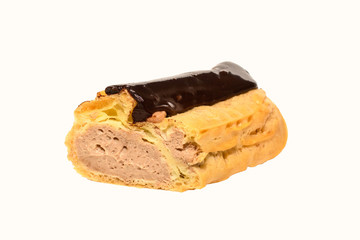 Close up view of eclair with cream. Cut in half filled profiterole with vanilla cream .Traditional French dessert 