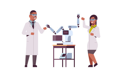 scientists couple near industrial robotic arms african american man woman in uniform with robot manipulators smart medical machine automatic technology concept full length flat horizontal