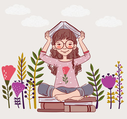 Cute, little girl with book in the garden