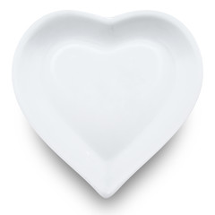 White plate in shape of heart isolated on white background.