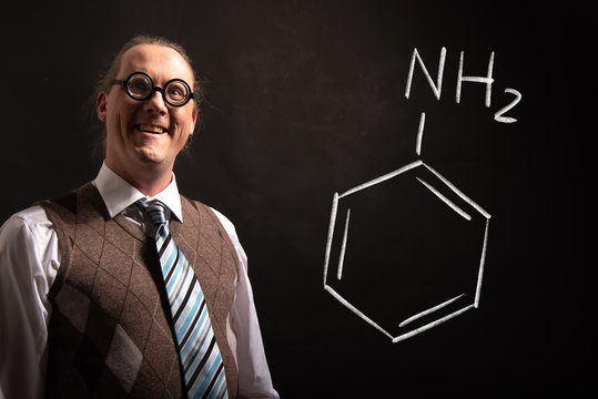 Professor presenting handdrawn chemical formula of aniline