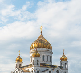 golden domes of the church with crosses against the sky