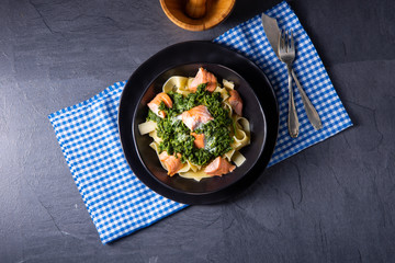 pappardelle pasta with creamed spinach and fried salmon