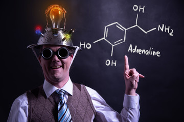 Nerd presenting handdrawn chemical formula of adrenaline