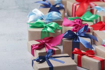 Gifting boxes with colorful satin ribbon bows	