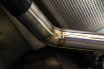 Fabrication and installation of a stainless steel car exhaust pipe with a bifurcation and a louder...