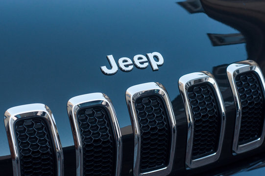 Mulhouse - France - 4 September 2019 - Closeup of Jeep logo on black car front parked in the street