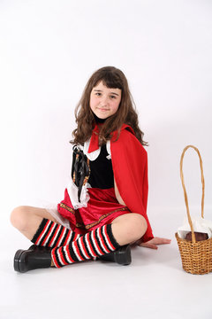 little red riding hood with a basket in hand