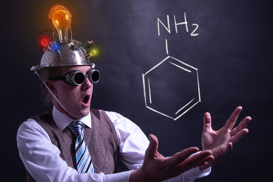 Nerd presenting handdrawn chemical formula of amphetamine