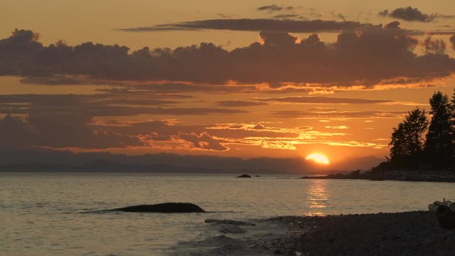 Sunshine Coast Sunset British Columbia 4K UHD. Roberts Creek Beach at sunset on the Sunshine Coast near Sechelt. BC, Canada. 4K UHD.
