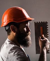 Plastering tools. Tool, trowel, handyman, man builder. Mason tools, builder. Builders in hard hat,...