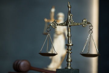 Law and Justice, judge gavel with scales on wooden table.