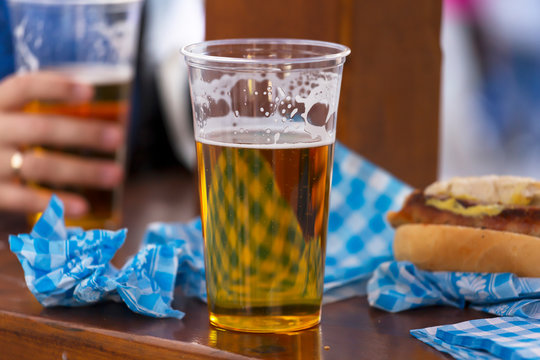 Oktoberfest. Glass of beer and meat sandwich at the beer and street food festival