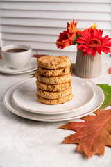 cookies and coffee, autumn colour leaves, Gerbera daisy, marble backdrop, light background