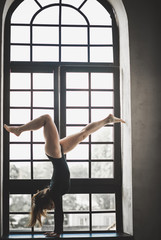 Gymnastic girl at vintage window, athletic and sport lifestyle concept 