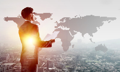 Concept of business success and control with confident boss against cityscape background