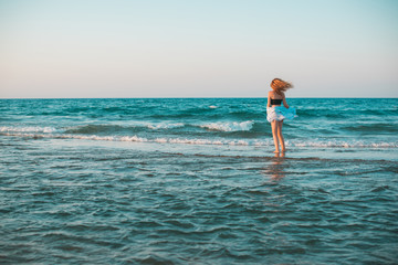 Fototapeta premium Freedom concept, redhead woman rest at sea, vacation and holidays time. 