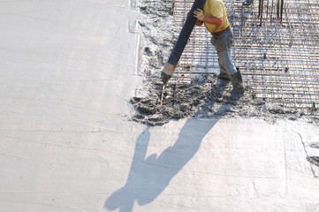 Concrete pouring during commercial concreting floors of buildings in construction