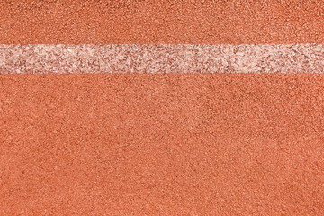 Surface of rubber pellets in treadmill athletics field texture background