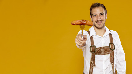 Man with german sausage and copy space