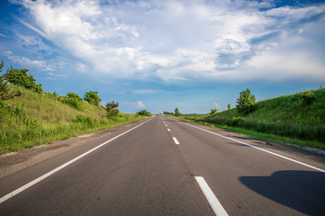 Asphalt highways and mountains under the blue sky