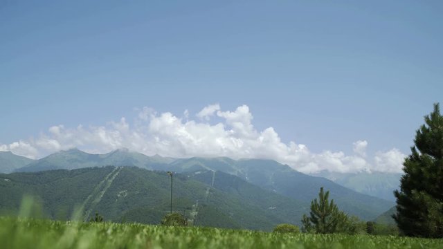 Mountain nature panoramic landscape in caucasus mountains with blue skay and clouds
