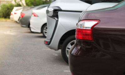 Closeup of rear side of purple car parking in parking area.