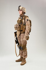 United states Marine Corps special operations command  raider with weapon. Studio shot