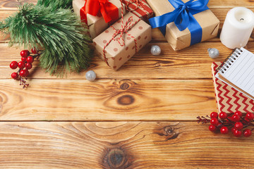 top view of wrapped christmas gift boxes on wooden background