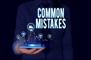 Text sign showing Common Mistakes. Business photo text actions that are often used interchangeably with error Woman wear formal work suit presenting presentation using smart device
