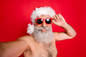 Self-portrait of his he nice attractive handsome funky content cheerful cheery glad gray-haired man having fun weekend trip tourism blog blogger isolated over bright vivid shine red background