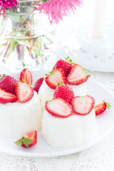 Panna Cotta with fresh strawberries, selective focus