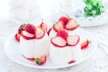 italian dessert panna cotta with fresh strawberries, horizontal