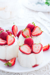 Panna Cotta with fresh strawberries, selective focus
