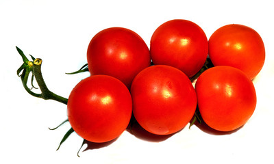 red tomatoes lie on the table
