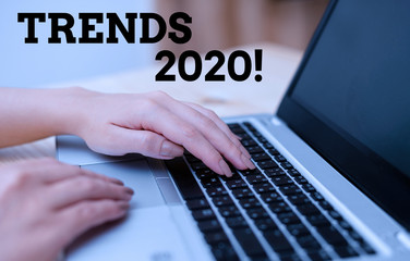 Text sign showing Trends 2020. Business photo text general direction in which something is developing or changing woman laptop computer smartphone mug office supplies technological devices
