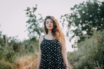 Young girl in summer time full of joy and harmony
